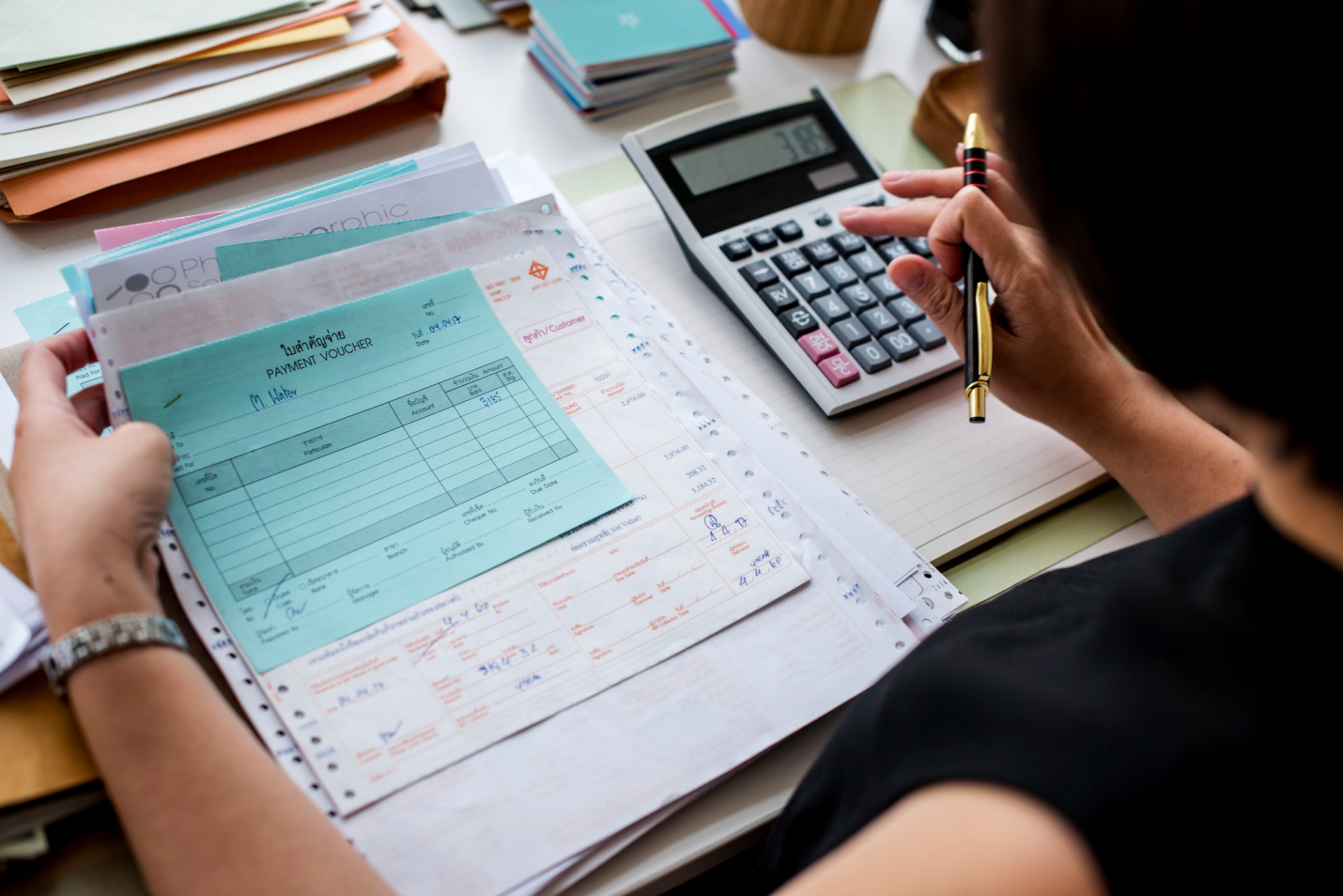 an individual using a calculator