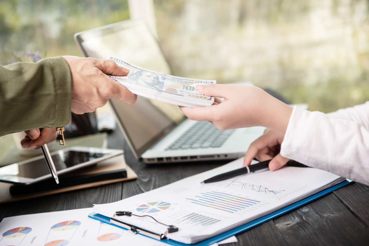 an individual handing over cash