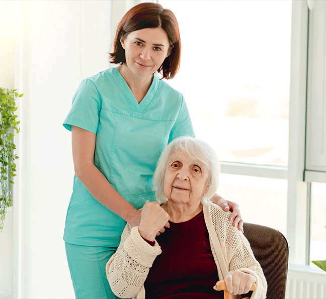 Elderly woman with caregiver
